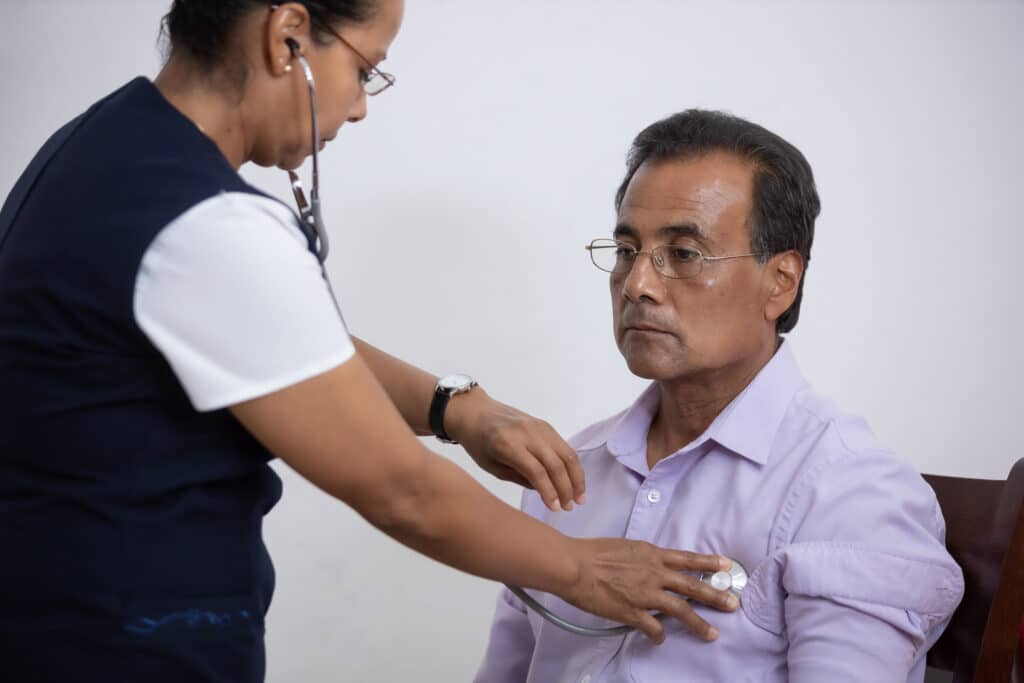 mexican nurse examining the patient with a stethos 2025 02 12 00 10 29 utc